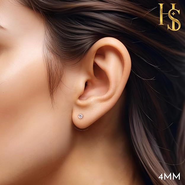 Elegant diamond stud earrings for women displayed on woman's earlobe
