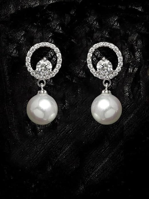 Elegant pearl silver earrings on woman showcasing classic stud design